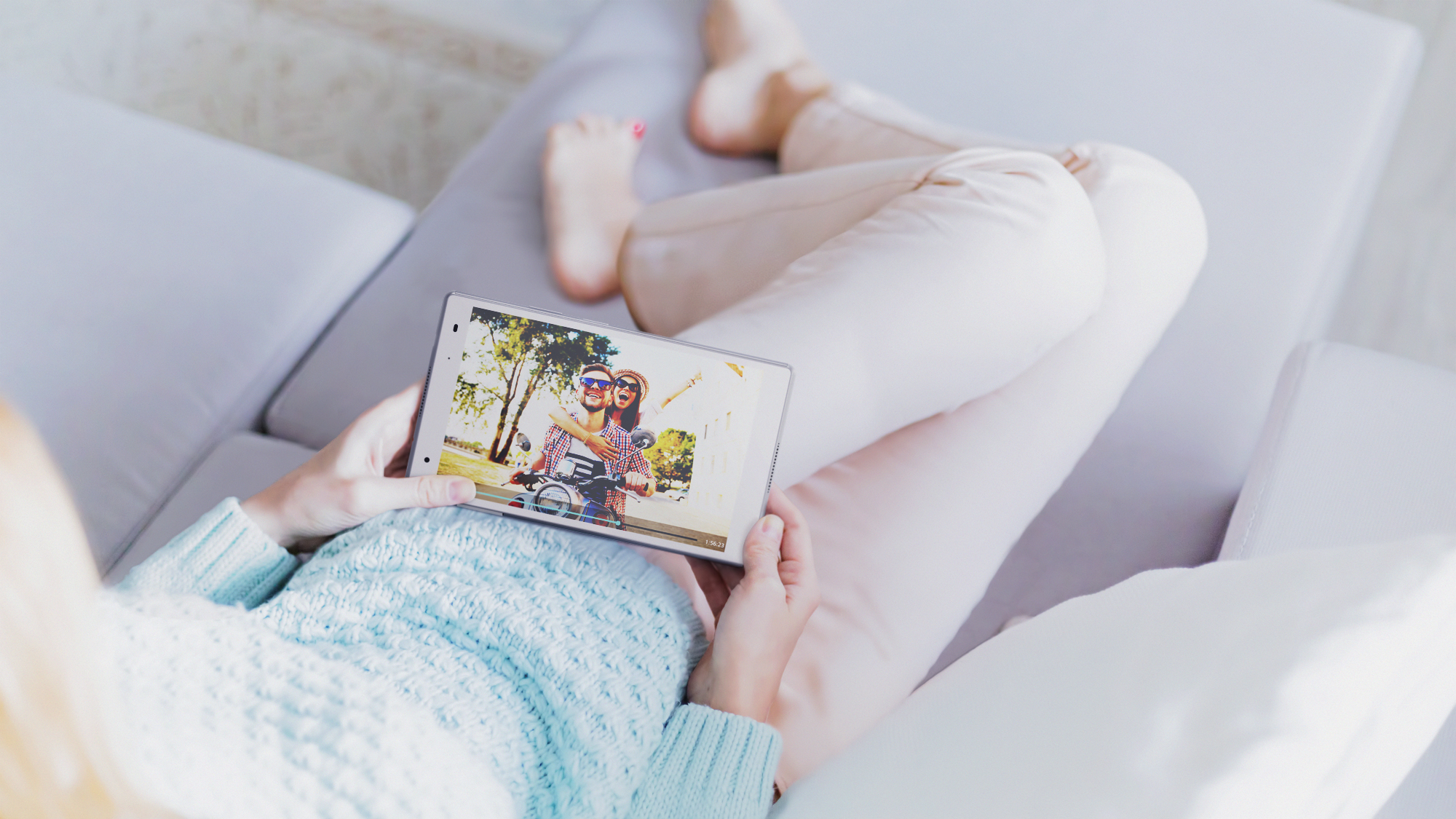 Lenovo_Tab_4_8_Plus_watching_movie_on_sofa_White